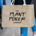 A carrier bag branded by The Plant Power Company